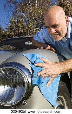 man polishing his classic car with cloth View Large Photo Image Stock Image - man polishing his classic car with cloth. Fotosearch