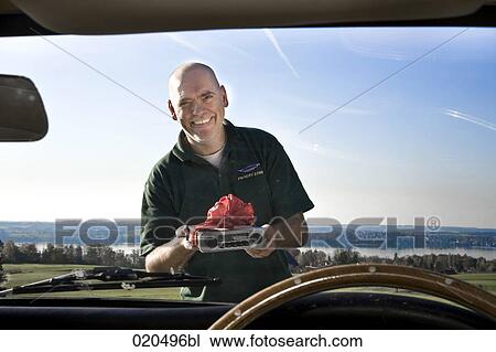 portrait of bald man holding radio for his classic car seen through window View Large Photo Image Stock Image - portrait of bald man holding radio for his classic car seen through window. Fotosearch