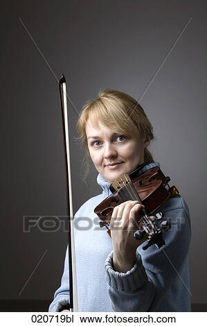 Stock Image - portrait of blond woman with violin. Fotosearch