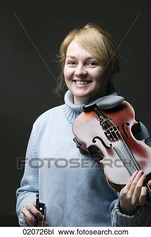 portrait of blond woman with violin View Large Photo Image Stock Image - portrait of blond woman with violin. Fotosearch