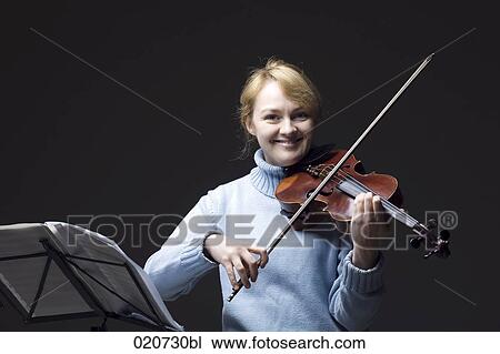 Stock Image - portrait of blond woman with violin. Fotosearch