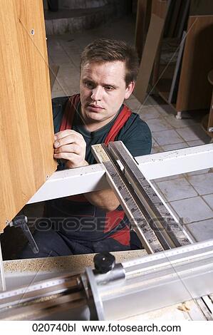portrait of craftsman assembling furniture in workshop View Large Photo Image Stock Image - portrait of craftsman assembling furniture in workshop. Fotosearch