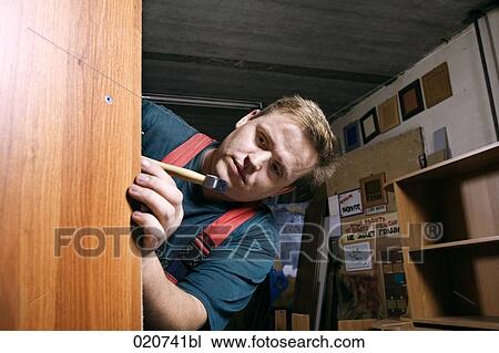 portrait of craftsman assembling furniture in workshop View Large Photo Image Stock Image - portrait of craftsman assembling furniture in workshop. Fotosearch