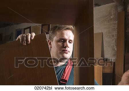 portrait of craftsman assembling furniture in workshop View Large Photo Image Stock Image - portrait of craftsman assembling furniture in workshop. Fotosearch
