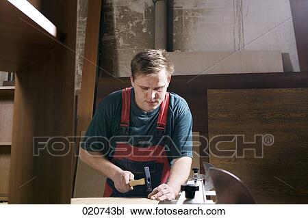 portrait of craftsman assembling furniture in workshop View Large Photo Image Stock Image - portrait of craftsman assembling furniture in workshop. Fotosearch