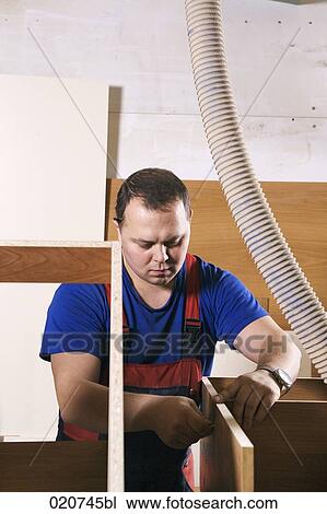 portrait of craftsman assembling furniture in workshop View Large Photo Image Stock Image - portrait of craftsman assembling furniture in workshop. Fotosearch