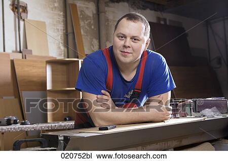 portrait of craftsman in workshop View Large Photo Image Stock Image - portrait of craftsman in workshop. Fotosearch
