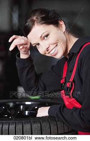 Stock Image - portrait of exhausted female mechanic. Fotosearch