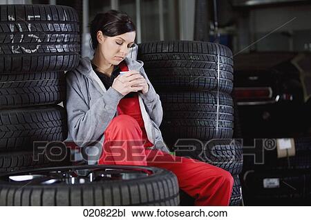 portrait of female mechanic having a nap in garage View Large Photo Image Stock Image - portrait of female mechanic having a nap in garage. Fotosearch