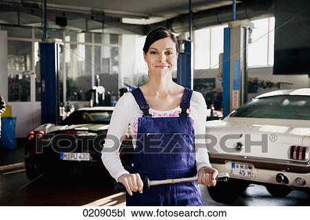 portrait of female mechanic in garage View Large Photo Image Stock Image - portrait of female mechanic in garage. Fotosearch