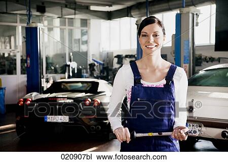 portrait of female mechanic in garage View Large Photo Image Stock Image - portrait of female mechanic in garage. Fotosearch