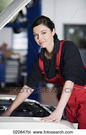 portrait of female mechanic repairing car engine View Large Photo Image Stock Image - portrait of female mechanic repairing car engine. Fotosearch