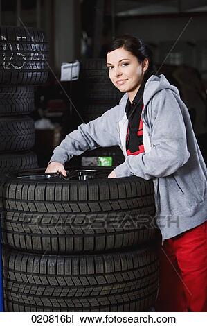 portrait of female mechanic with tires View Large Photo Image Stock Image - portrait of female mechanic with tires. Fotosearch