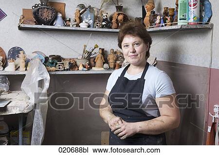 portrait of female potter in her workshop View Large Photo Image Stock Image - portrait of female potter in her workshop. Fotosearch