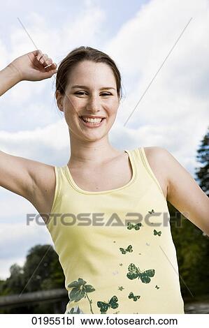 Stock Image - portrait of joyous young woman. Fotosearch