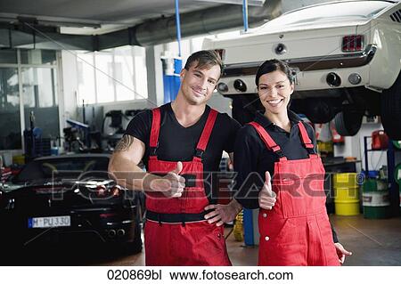 portrait of two mechanics doing thumbs up sign View Large Photo Image Stock Image - portrait of two mechanics doing thumbs up sign. Fotosearch