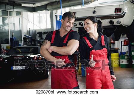 portrait of two mechanics doing thumbs up sign View Large Photo Image Stock Image - portrait of two mechanics doing thumbs up sign. Fotosearch