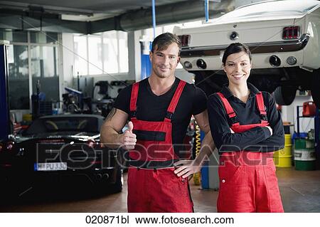 portrait of two mechanics doing thumbs up sign View Large Photo Image Stock Image - portrait of two mechanics doing thumbs up sign. Fotosearch