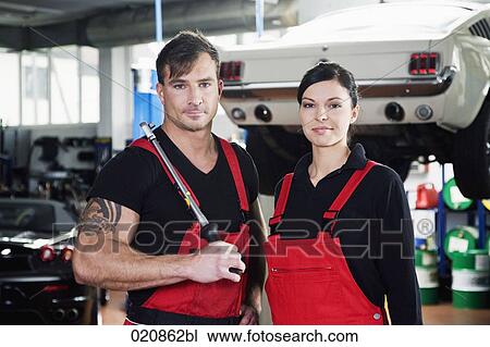 portrait of two mechanics in garage View Large Photo Image Stock Image - portrait of two mechanics in garage. Fotosearch