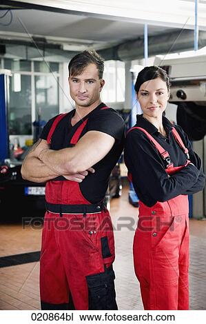 Stock Image - portrait of two mechanics in garage. Fotosearch
