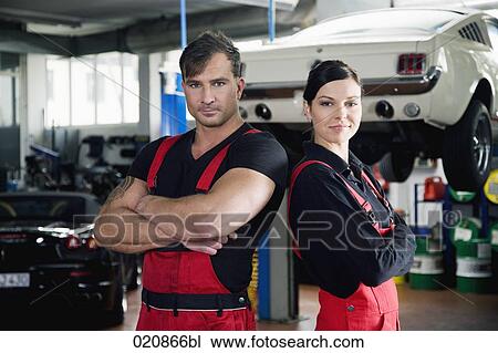 portrait of two mechanics in garage View Large Photo Image Stock Image - portrait of two mechanics in garage. Fotosearch