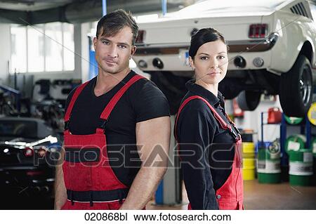 portrait of two mechanics in garage View Large Photo Image Stock Image - portrait of two mechanics in garage. Fotosearch