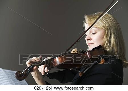 portrait of woman playing violin View Large Photo Image Stock Image - portrait of woman playing violin. Fotosearch