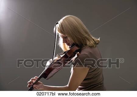 Stock Image - portrait of woman playing violin. Fotosearch
