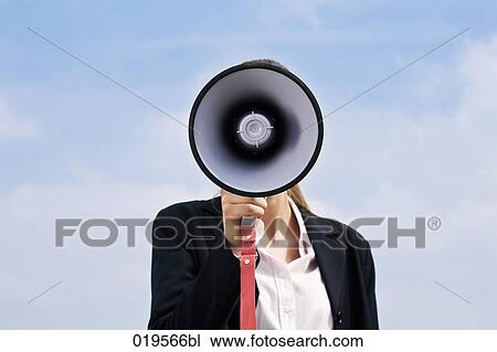 portrait of young businesswoman hidden behind megaphone View Large Photo Image Stock Image - portrait of young businesswoman hidden behind megaphone. Fotosearch