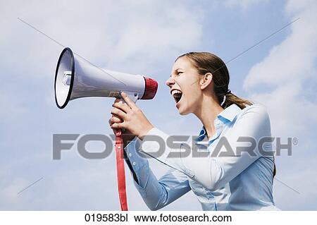 portrait of young businesswoman shouting through megaphone View Large Photo Image Stock Image - portrait of young businesswoman shouting through megaphone. Fotosearch