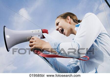 portrait of young businesswoman shouting through megaphone View Large Photo Image Stock Image - portrait of young businesswoman shouting through megaphone. Fotosearch