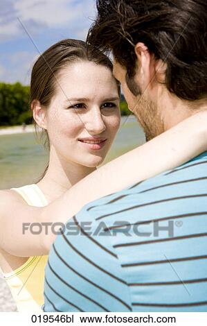 portrait of young couple in tender embrace outdoors View Large Photo Image Stock Image - portrait of young couple in tender embrace outdoors. Fotosearch