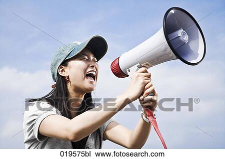 portrait of young japanese woman shouting through megaphone View Large Photo Image Stock Image - portrait of young japanese woman shouting through megaphone. Fotosearch