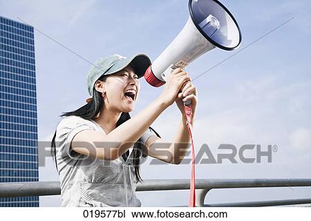portrait of young japanese woman shouting through megaphone View Large Photo Image Stock Image - portrait of young japanese woman shouting through megaphone. Fotosearch