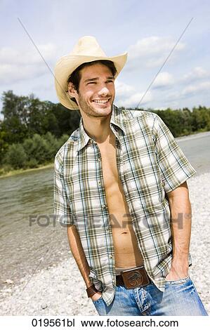 portrait of young man with open shirt outdoors View Large Photo Image Stock Image - portrait of young man with open shirt outdoors. Fotosearch