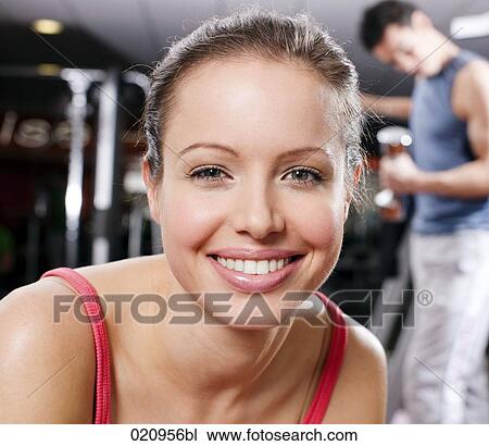 portrait of young woman in gym View Large Photo Image Stock Image - portrait of young woman in gym. Fotosearch