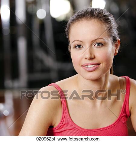 portrait of young woman in gym View Large Photo Image Stock Image - portrait of young woman in gym. Fotosearch