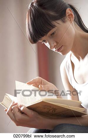 portrait of young woman reading book View Large Photo Image Stock Image - portrait of young woman reading book. Fotosearch