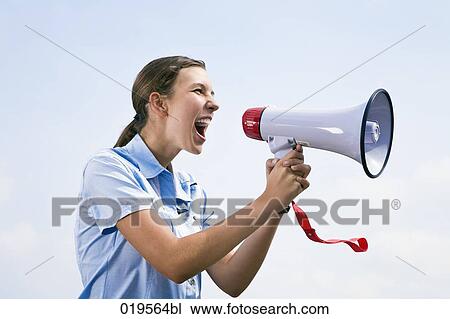 side view of young businesswoman shouting through megaphone View Large Photo Image Stock Image - side view of young businesswoman shouting through megaphone. Fotosearch