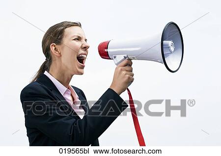 side view of young businesswoman shouting through megaphone View Large Photo Image Stock Image - side view of young businesswoman shouting through megaphone. Fotosearch
