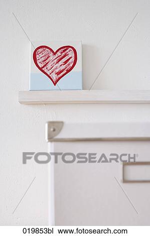 Stock Image - still life of box and little painting with red heart. Fotosearch