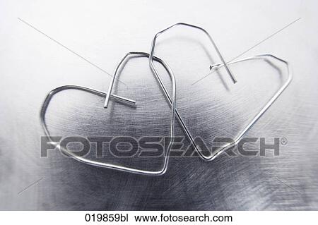 still life of two paper clips in shape of hearts View Large Photo Image Stock Image - still life of two paper clips in shape of hearts. Fotosearch