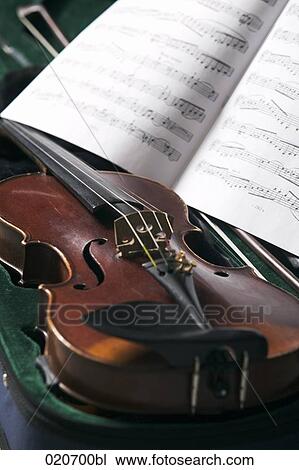 still life of violin in case and sheet of music View Large Photo Image Stock Image - still life of violin in case and sheet of music. Fotosearch