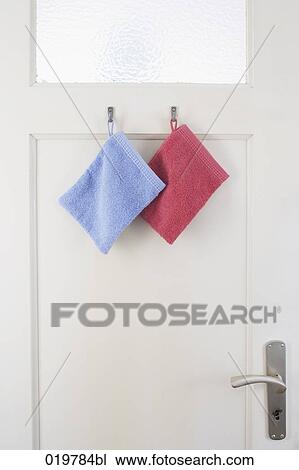 two washcloths hanging on bathroom door View Large Photo Image Stock Image - two washcloths hanging on bathroom door. Fotosearch