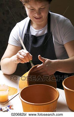 woman painting jar in workshop View Large Photo Image Stock Image - woman painting jar in workshop. Fotosearch