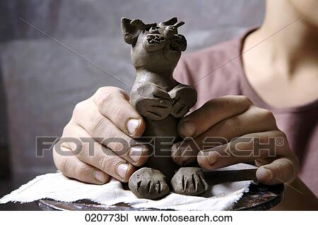 young boy making little sculpture out of clay View Large Photo Image Stock Image - young boy making little sculpture out of clay. Fotosearch