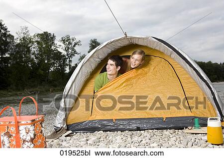 young couple peeking through tent in the morning View Large Photo Image Stock Image - young couple peeking through tent in the morning. Fotosearch