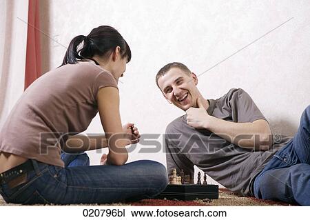 young couple playing chess together View Large Photo Image Stock Image - young couple playing chess together. Fotosearch