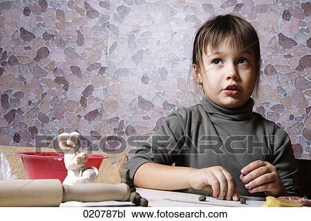 young girl working with clay View Large Photo Image Stock Image - young girl working with clay. Fotosearch