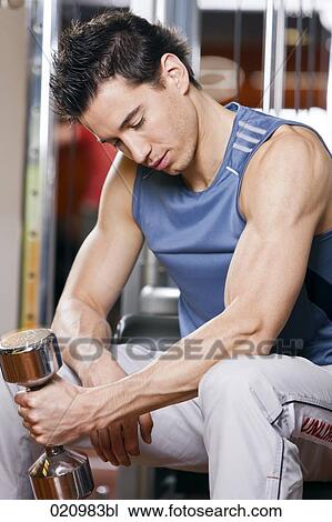 young man exercising with dumb bell View Large Photo Image Stock Image - young man exercising with dumb bell. Fotosearch